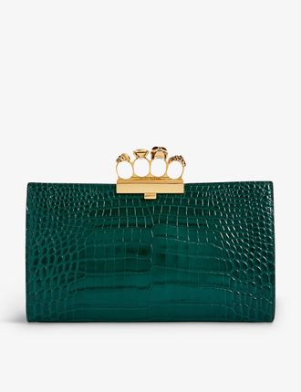 Four-ring crocodile-embossed leather clutch bag
